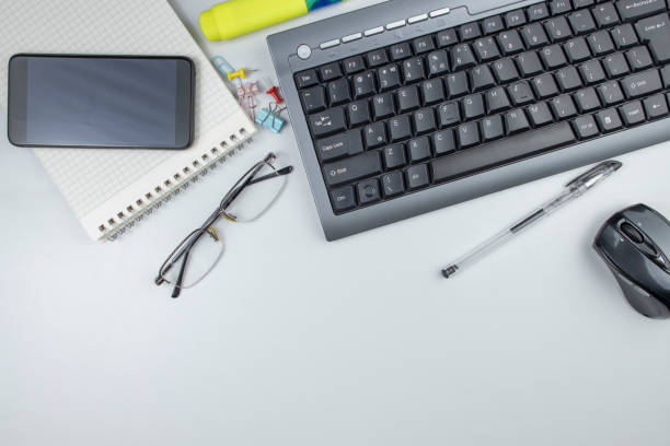 istock Workplace in the office computer keyboard and stationery, top view, copy space. 1394926664