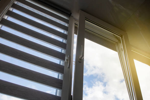 istock a plastic window with a roller blind and a mosquito net against a blue sky 1394927631