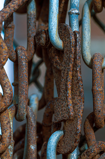 Rusty, old chains and metal elements close-up