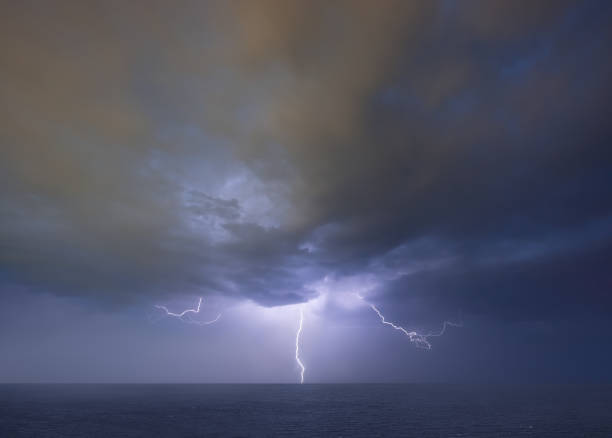 istock Lightning thunderstorm on stormy dark sky over the sea 1394930109