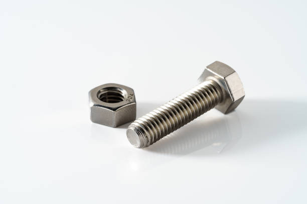 istock Stainless steel nuts and bolts closeup on white background 1394931101