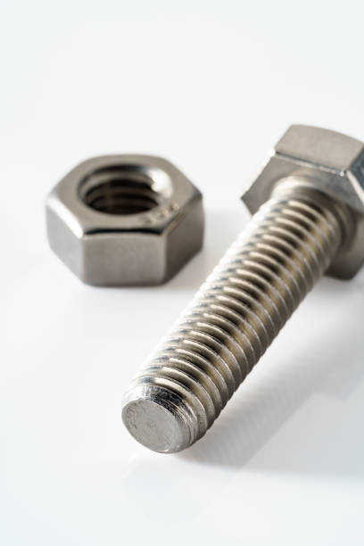 istock Stainless steel nuts and bolts closeup on white background 1394931105