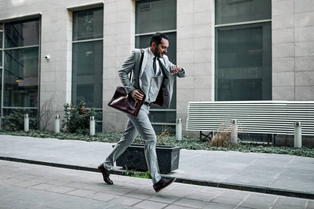 Businessman getting late to work
