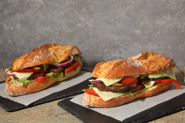 istock Burger with Baguette Bread on the wooden table 1394932390