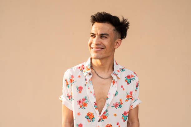istock Portrait of handsome young cool man against plain background 1394932704