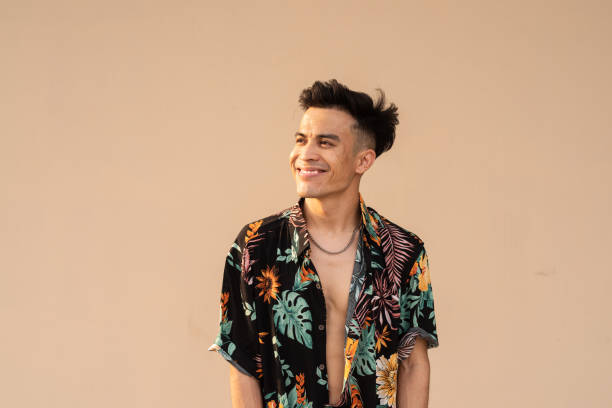 istock Portrait of handsome young cool man against plain background 1394934289