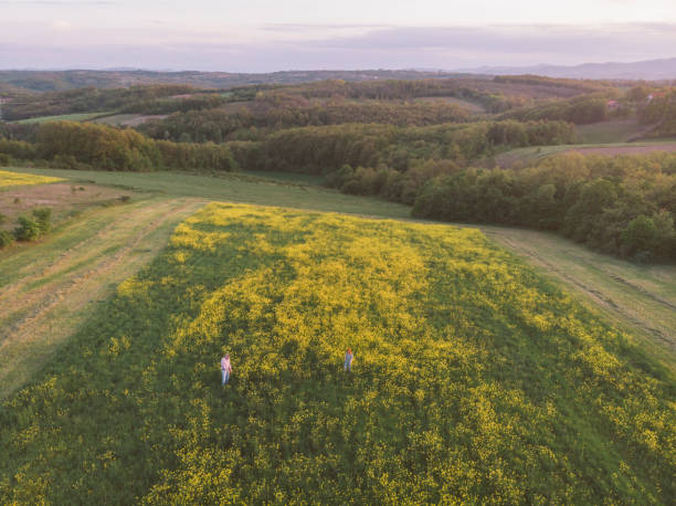 istock Farmers at their oilseed rape field 1394934455