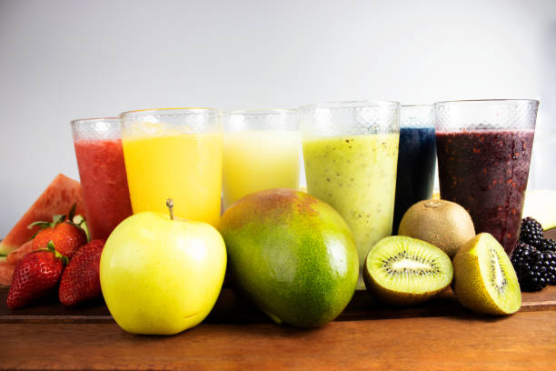 istock fruit juice or smoothies on wood 1394934612