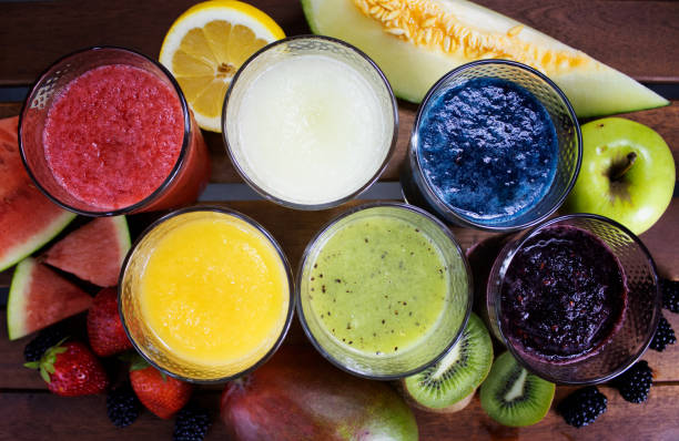 fruit juice or smoothies on wood seen from above stock photo