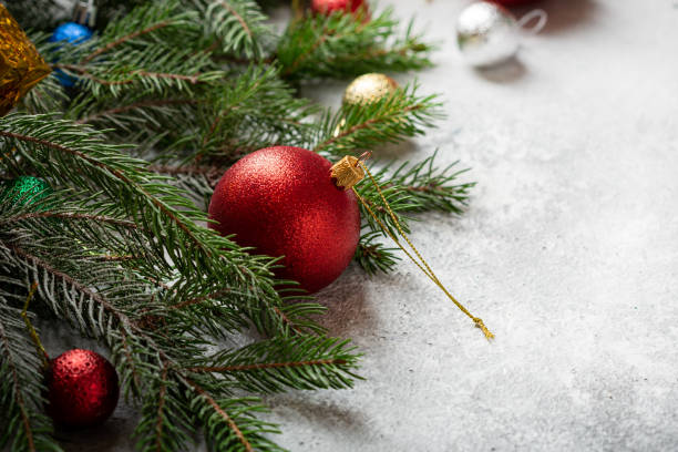 istock Red Christmas decoration ball and green branches 1394936469
