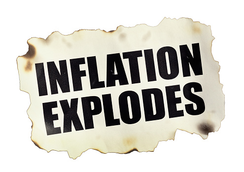Torn newspaper headline, isolated on white, reads INFLATION EXPLODES.