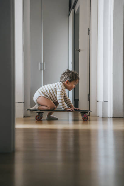 istock Little Boy with skate at Home 1394937540
