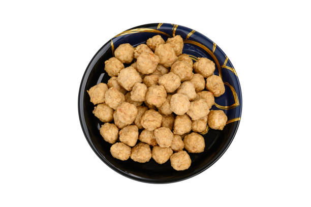 istock Meat or Fried Shrimp Balls placed in a black plate  isolated on white background 1394938905
