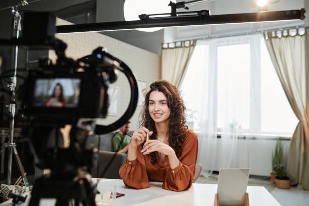 istock Happy young female making speech during commercial record in studio 1394939986