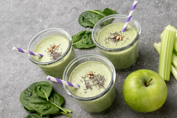 istock Healthy green spinach smoothie in glass jars 1394940431