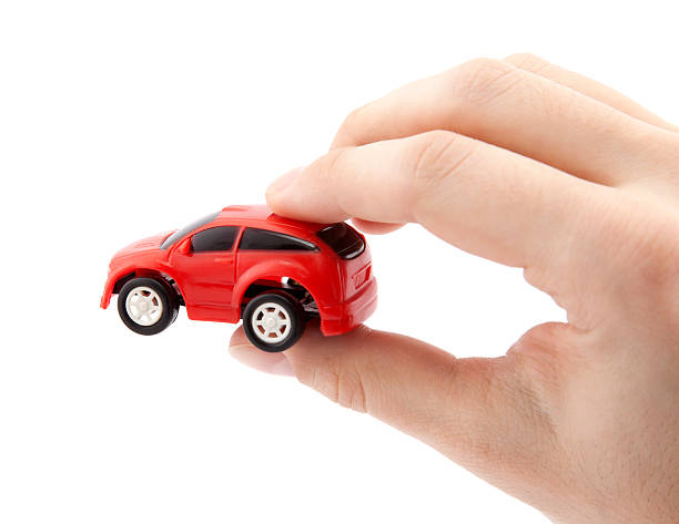istock Hand holding a small red car 139494115