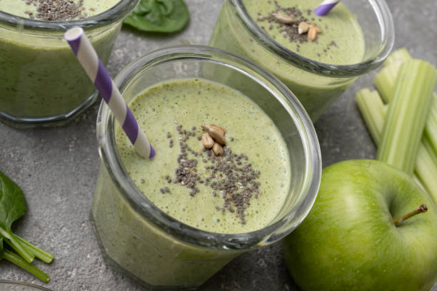 istock Healthy green spinach smoothie in glass jars 1394941490