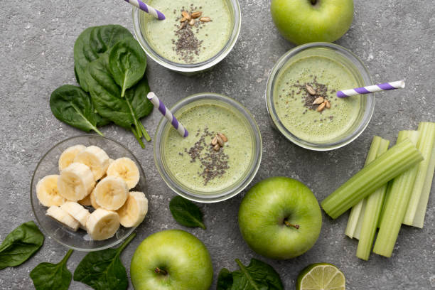 istock Healthy green spinach smoothie in glass jars 1394942203