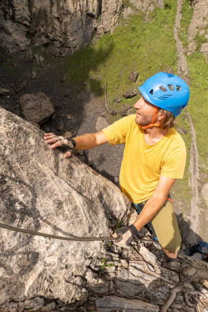 istock High angle view, man on Via Ferrata climbing up, summer activities concept 1394942625