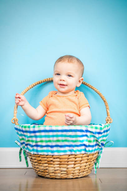 istock Eight Month Old Baby Boy in a Basket 1394943394
