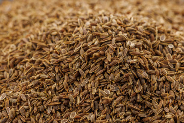 istock dry dill seeds pile, close-up background with selective focus 1394945206