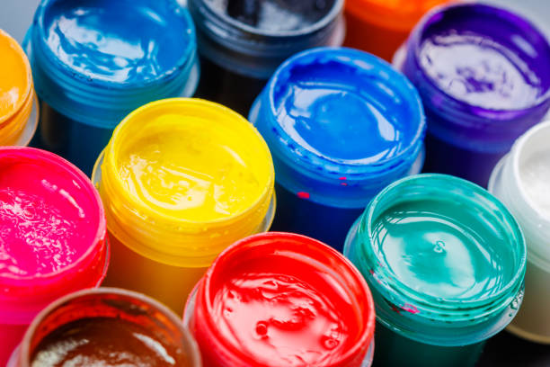 istock full-frame close-up background of opened small gouache paint jars 1394945230