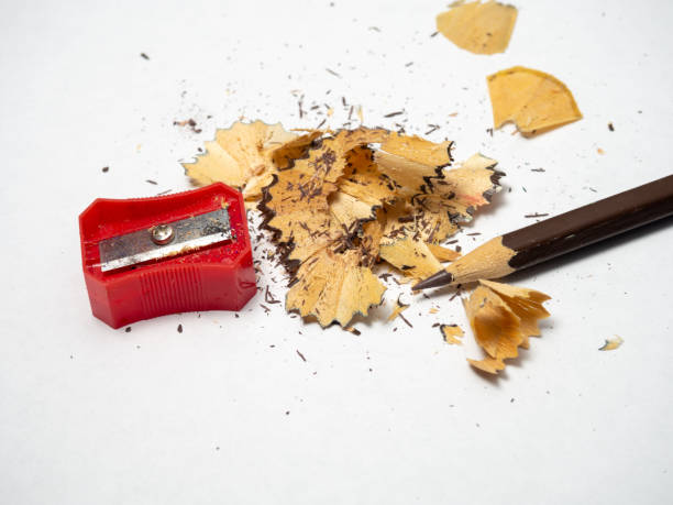 istock Artist's workshop.   Pencil sharpening. Multicolored pencils. Wood and graphite shavings. The process of preparing for work. Creative mess 1394946411