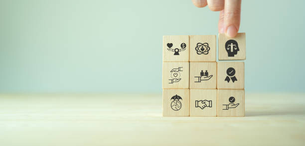 istock Business ethics concept. Ethics inside human mind. Business integrity and moral. Putting wooden cubes with ethics inside a head standing with other ethics icon. Company culture and sustainable success 1394947337