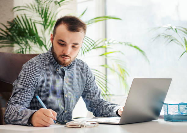 istock Businessman working on his laptop in an office 1394947437