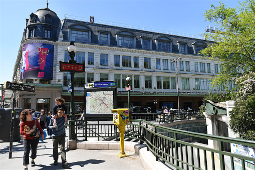 Paris, France-04 30 2022:People passing in front of the Bon Marché department store in Paris, France. Le Bon Marché or \