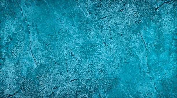 istock Blue green abstract background. Toned rough rock surface texture. Beautiful teal background with copy space for design. 1394950596