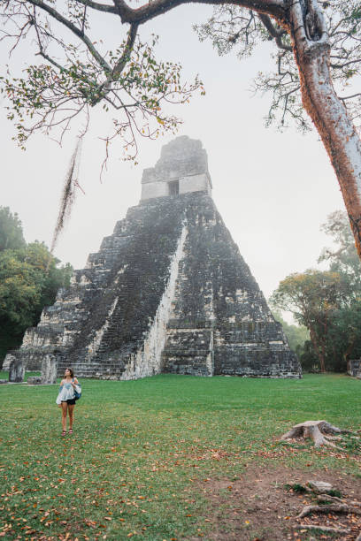 istock Woman exploring Tikal National Park 1394958533