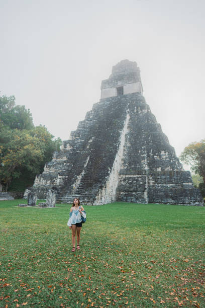 istock Woman exploring Tikal National Park 1394958572