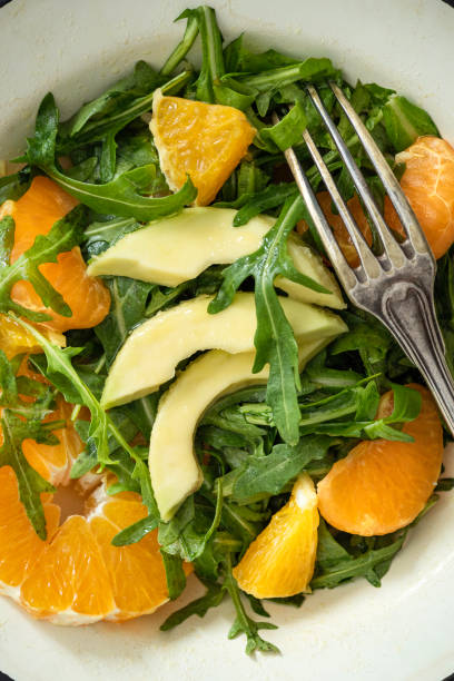 slices of orange and radish sprinkled with cinnamon on turquoise plate