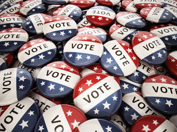 istock Stack of vote badges with American flag colors 1394965362
