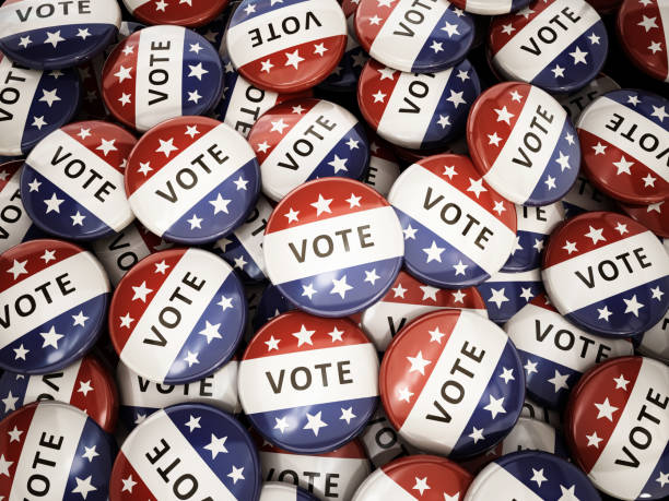 istock Stack of vote badges with American flag colors 1394965416