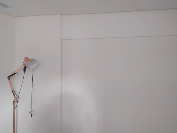 istock Unplugged pink lamp shot against a white wall 1394965503