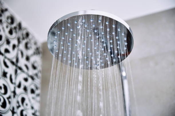 istock Water flowing from shower head in bathroom 1394965557