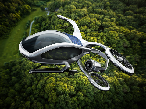 Conceptual eVTOL (electric vertical take-off and landing) aircraft flying against a dense forest background.