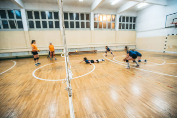 istock Female volleyball player digs 1394969053