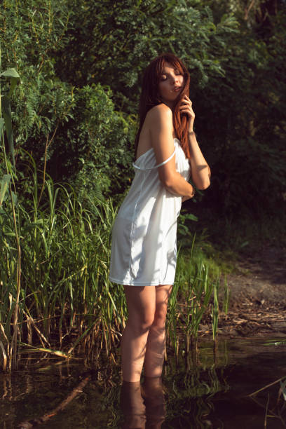 istock Young brunette woman on a sunny summer day 1394969990