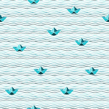 Seamless pattern of blue waves and paper boats on white background