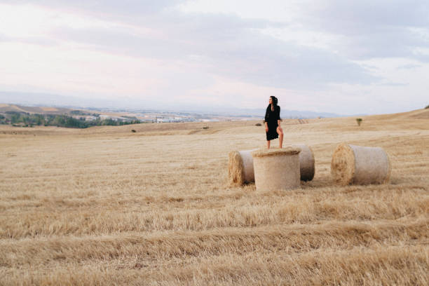 istock Happy young woman among rye field 1394972538