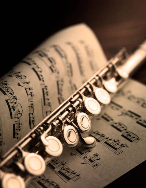 istock transverse flute resting on eighteenth-century classical music score 1394977613