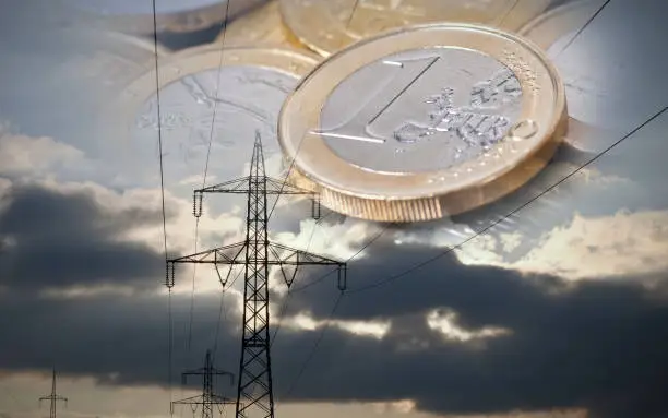 High voltage power line in connection with euro coins.