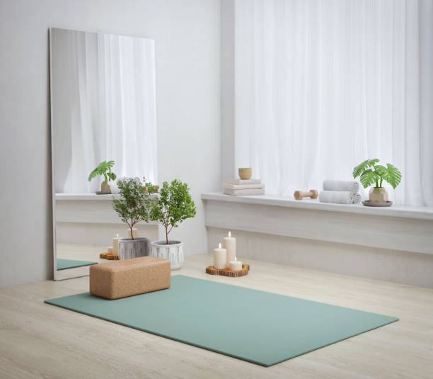 Yoga mat in yoga room with plant ,scented candle and mirror.3d rendering stock photo