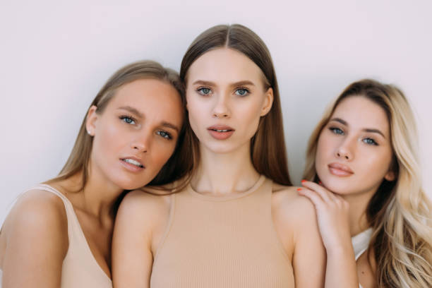 istock Three confident casual women standing on white studio background 1394978958
