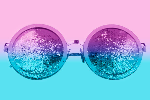 istock Violet sunglasses with sparkles on a two-tone background. 1394981512