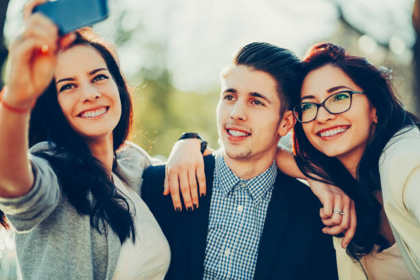 istock Young people taking selfie at the street 1394983935