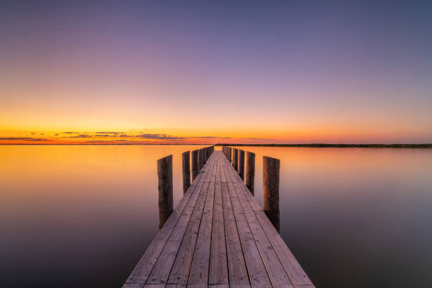 istock Wooden jetty at calm lake 1394984209